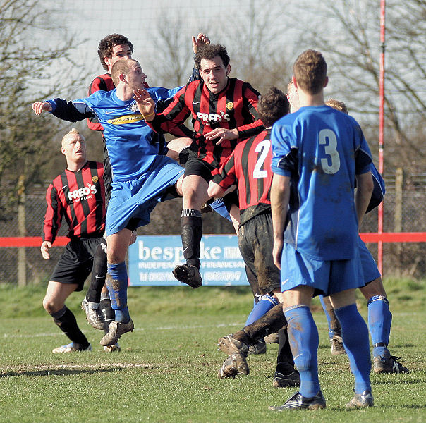 Chris Morrow, Josh Biggs and Pete Christodoulou competing for a header
