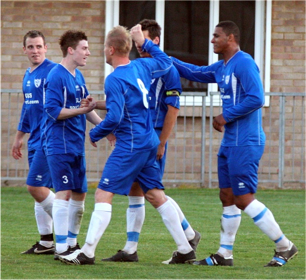 Carl Dunk is congratulated after scoring from the spot on 43 minutes
