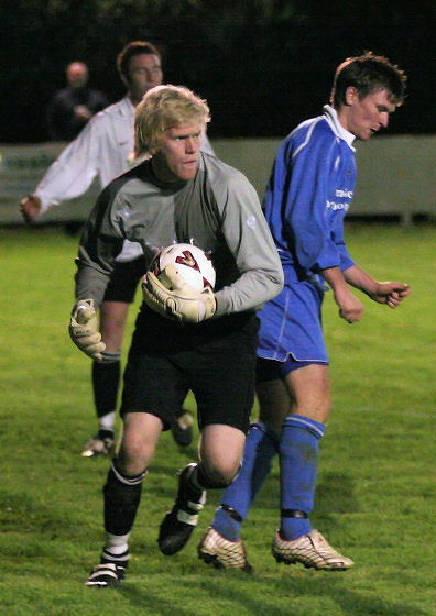 Tom Rand grabs the ball with Owen Callaghan challenging
