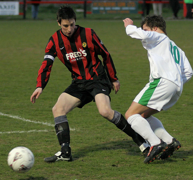 Dave Sharman gets the ball away from Scott Murfin
