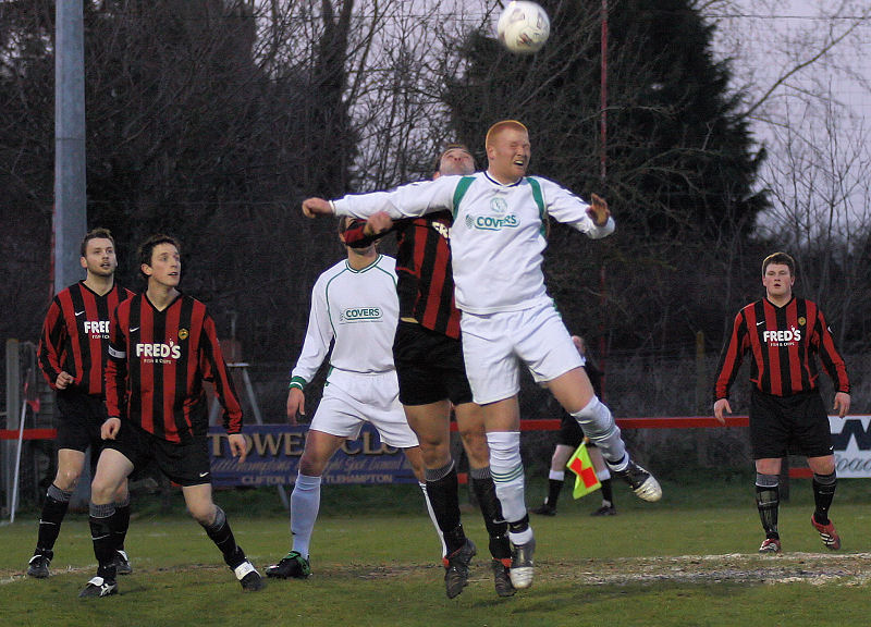 Pete Christodoulou and Scott Tipper compete for a header
