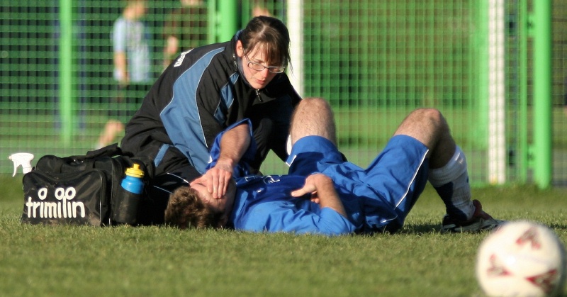 Physio Claire Davey attends to Richy Moss
