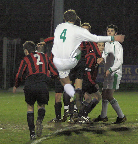 Ben Hitchman tries a shot through a group of defenders
