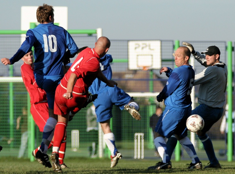 Ryan Walton (10) fires home Rustington's first goal ...
