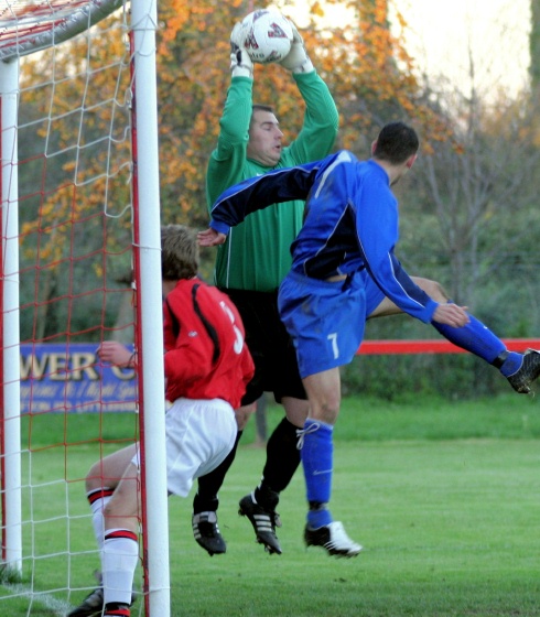 Wes Hallett takes an important catch pressured by Phil Churchill
