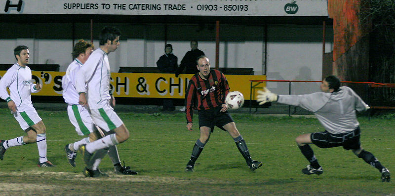 Darren Annis beats keeper Peter Houkes but the ball goes just wide
