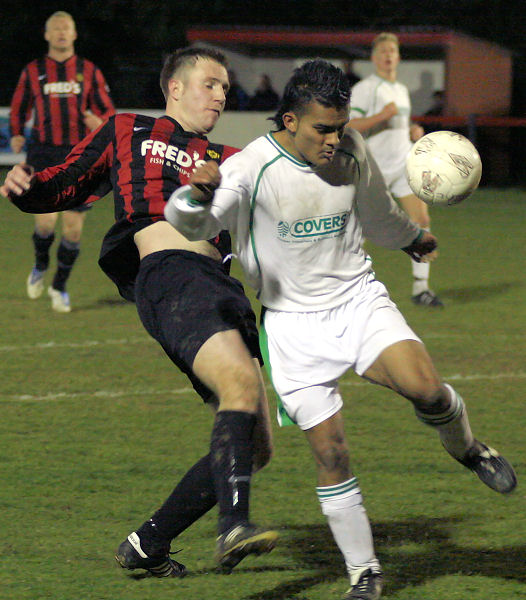 Danny Curd flicks the ball past Belal Miah
