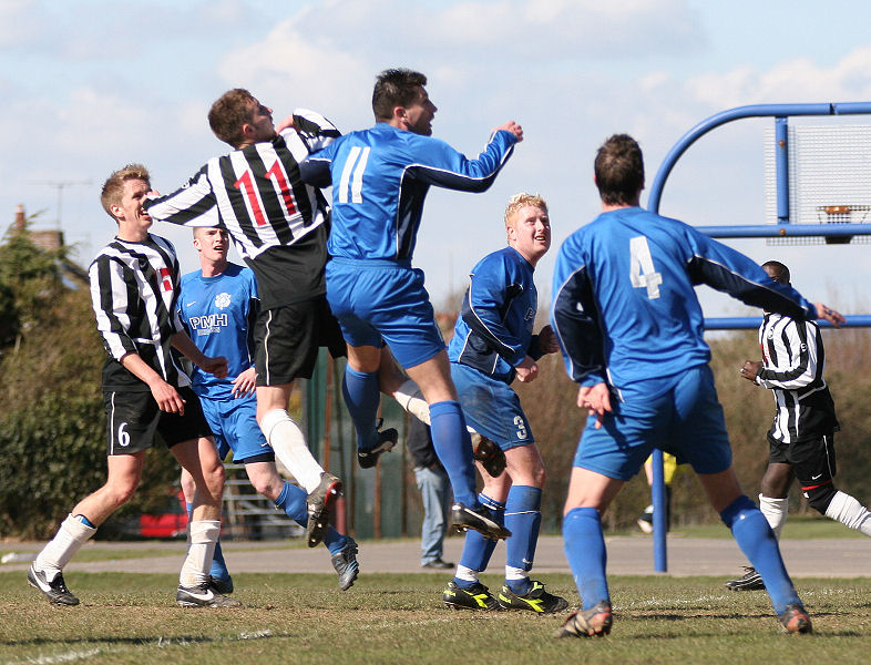 Simon Bailey and Terry Withers look for the header
