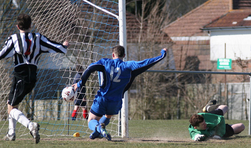 Craig Cox slides in to meet a cross on 78 minutes ...
