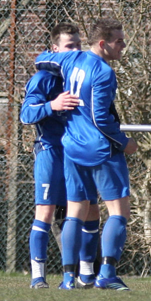 Craig Cox congratulates Ryan Morten on scoring on 85 minutes
