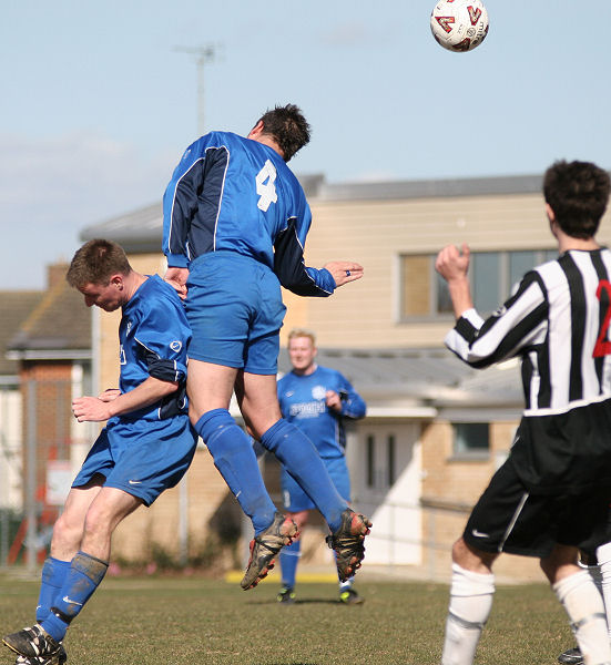 Brett Neal gets a header with 'assistance' from Mike Hatch
