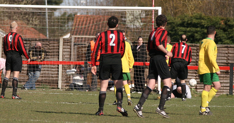 Russell Tanner turns the ball round the post
