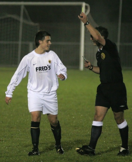 Adam Hunt picks up a yellow card
