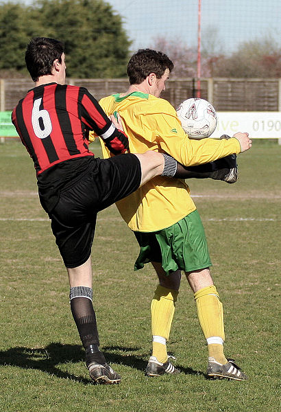 Dave Sharman hooks the ball away
