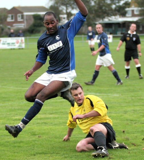 Barry Pidgeon nicks the ball away from Wayne Clarke into touch 
