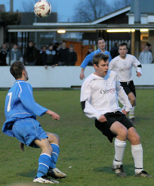 Peter Baker (7) turns past Dean Leaver
