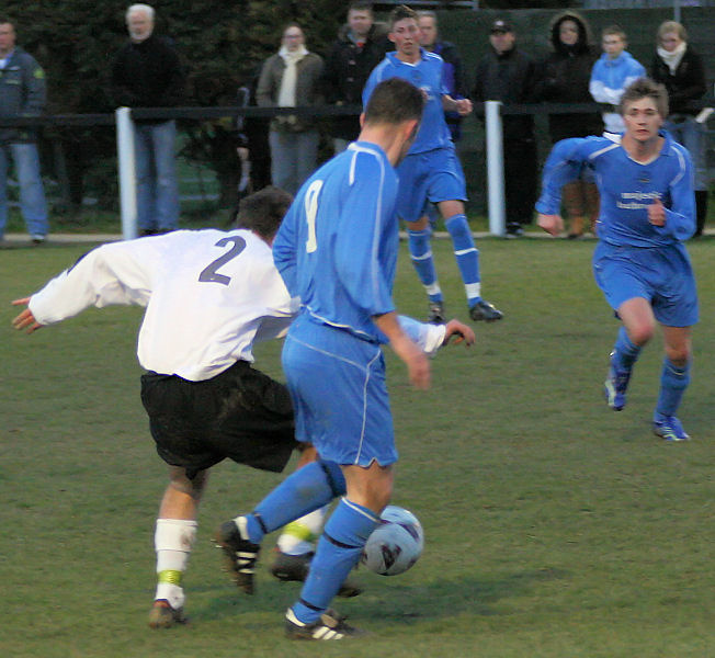 Andy Beaumont (2) tackles Jason Chandler (9)
