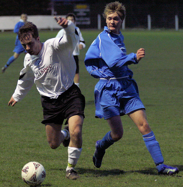 Andy Beaumont gets in ahead of Michael Bush
