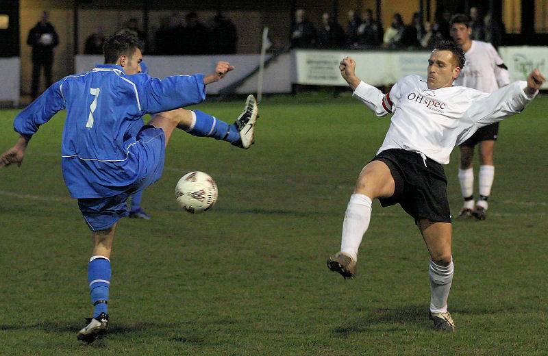 Peter Baker (7) and Matt Bridle stretch for the ball

