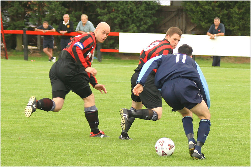 Tony Miles and Lee Howard defend against Darren Tidey
