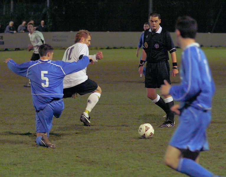 Gavin Bridle avoids a tackle from Pete Proto
