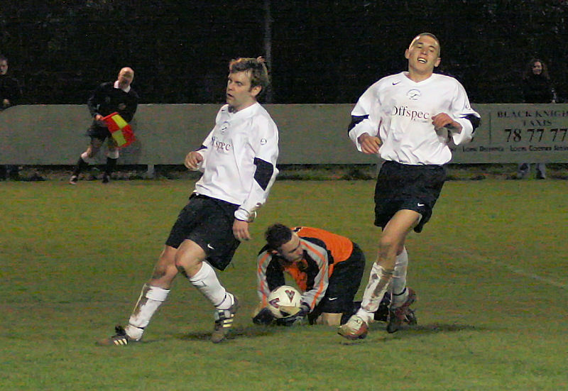 Jason Downer makes an important stop with Dean Leaver and Sam Witherden rushing in
