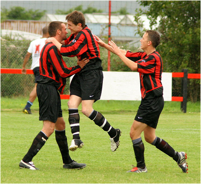 Adam Burton celebrates opening the scoring from the penalty spot
