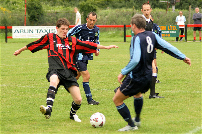 Adam Burton competes with Joe Clark as Paul Thomsett watches closely
