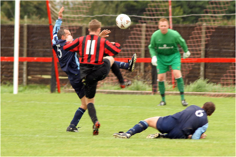 Paul Thomsett intercepts a Danny Curd attempt with Gary Stacey sliding in
