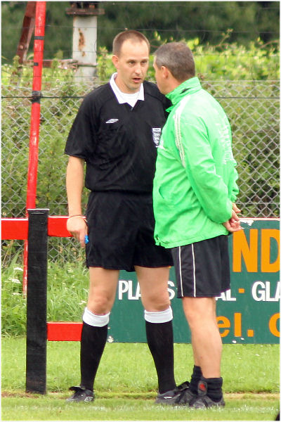 Referee Darren Eaton has words with Andy Gander
