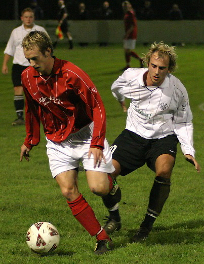 Mike Huckett brings the ball away from Josh Biggs
