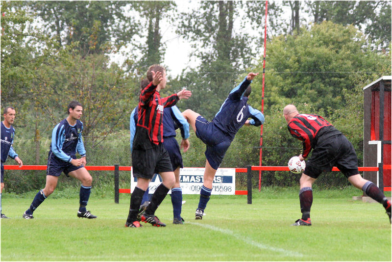 Ringmer clear a Wick attack as Danny Curd appeals for a penalty
