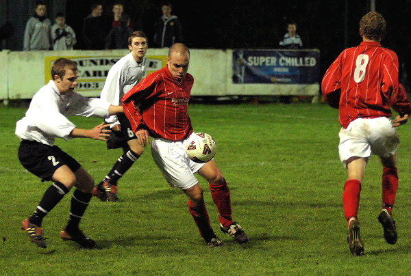 Matt Huckett keeps the ball away from Simon White
