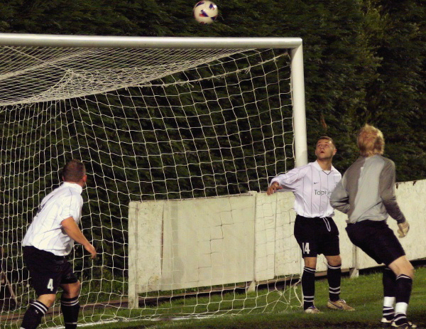 The East Preston defence are relieved to see this Arundel shot drop over the bar
