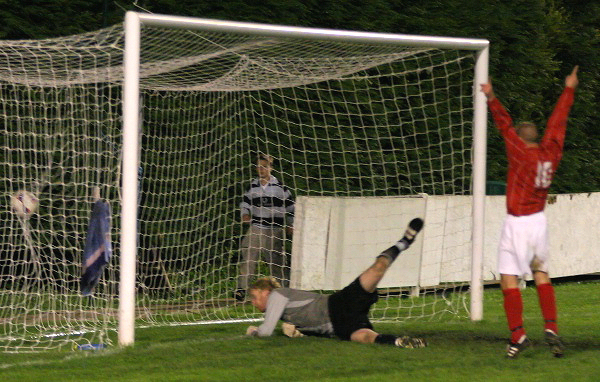 Tom Rand is beaten by an own goal which looped over him for 1-0 to Arundel
