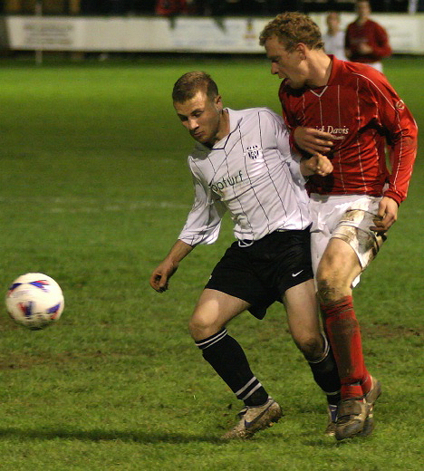 Simon Clayton is tackled by Jason Winch
