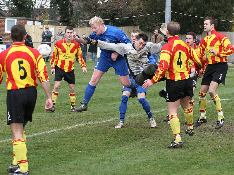 Kris Smithers punches away from Russ Tomlinson
