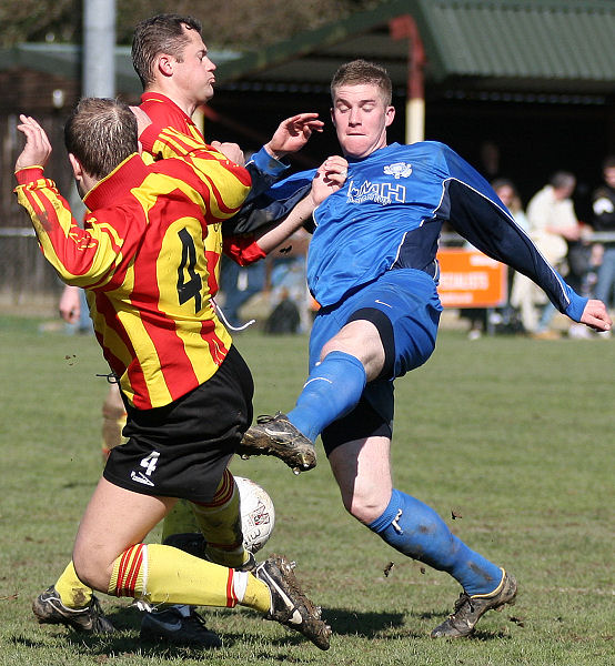 Andy Smart tries to get the ball past Louis Perkins
