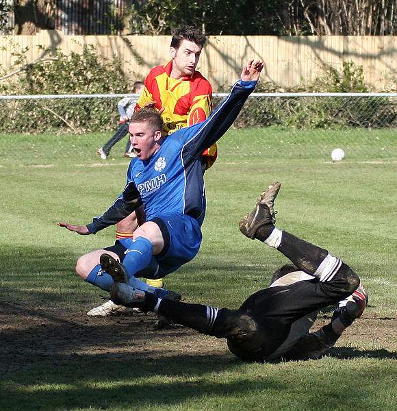 Kris Smithers takes the ball off Andy Smart's foot
