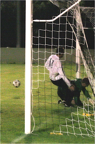 ... but the ball is cleared and the keeper crashes into the post

