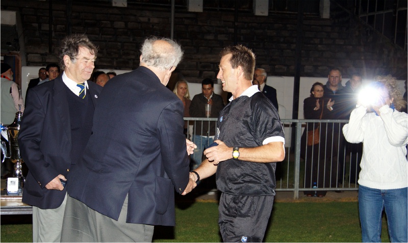 Referee Lloyd Macdonald receives his memento
