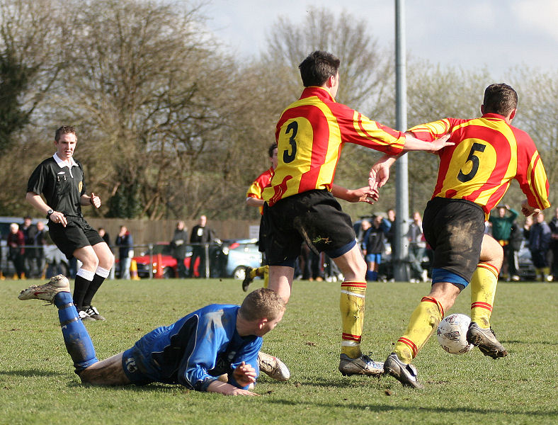 Mark Hillen (3) and Steven Moore (5) get the ball from James Highton
