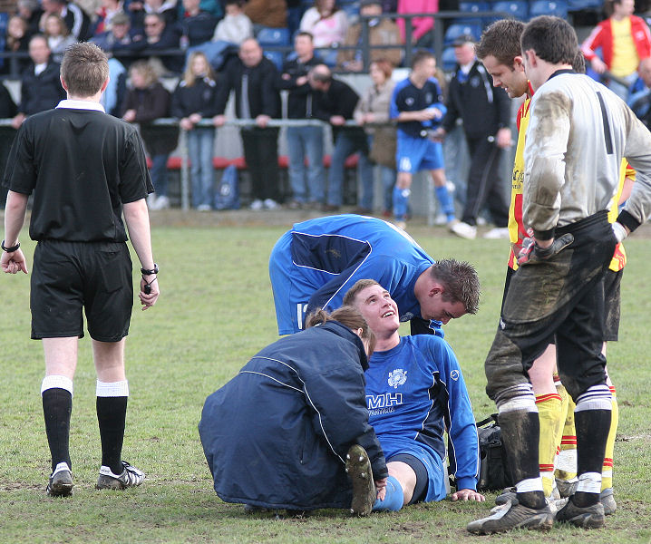 Andy Smart can still smile while he gets treatment from physio Claire Davey for what turned out to be broken bones in his ankle
