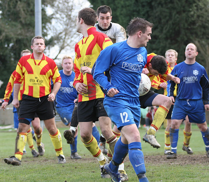 Lingfield clear an  attack which then brushes off Craig Cox for a goal kick
