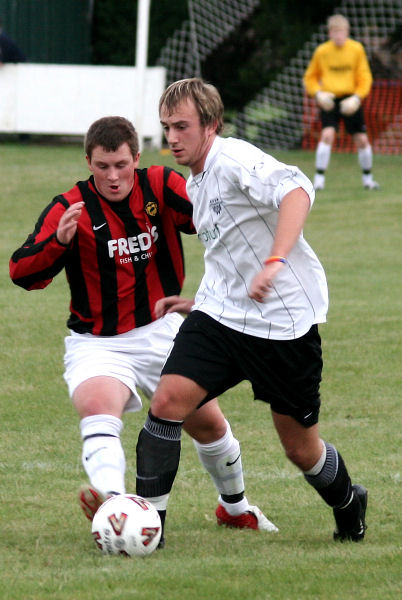 Lee Howard tackles Josh Biggs
