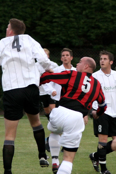 Tony Miles (5) beats Chris Hazell (4) buts sees his long range header caught by Paul Best
