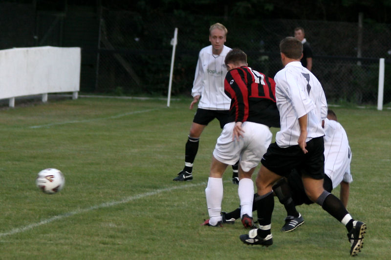 Seb Keet (?) gets in a tackle on Danny Curd (11)

