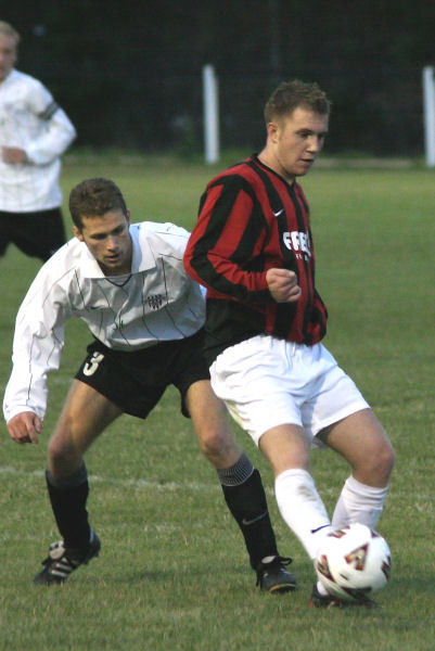 Danny Curd on the ball with Chris Yelling (3) watching closely
