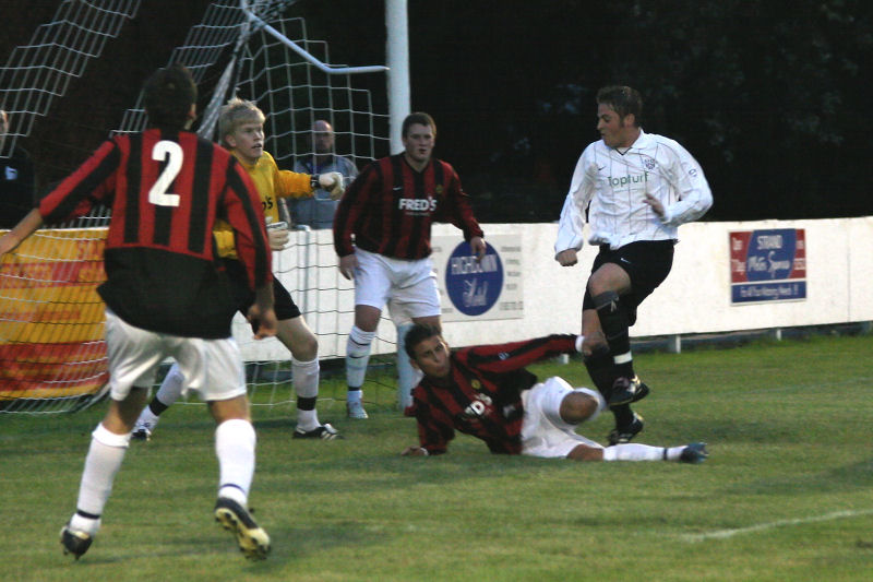 An East Preston effort is cut out by the Wick defence
