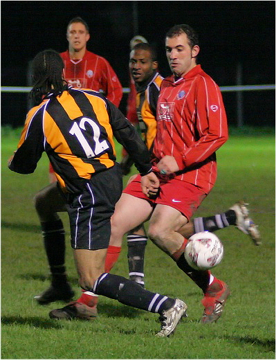 Pete Christodoulou cuts the ball out
